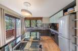 Discover a stunning kitchen with modern appliances and sleek design.