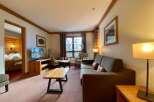 Discover a cozy living space with a comfortable sofa and inviting ambiance.