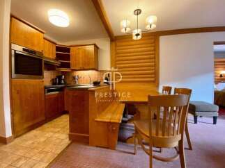 Discover the charm of this property, featuring a cozy kitchen with wooden cabinetry and modern appliances.