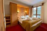 Discover a cozy bedroom with a touch of rustic charm.