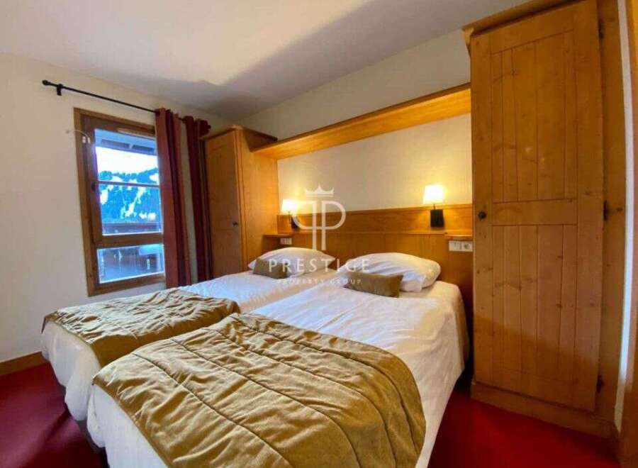 Cozy bedroom featuring two comfortable beds, perfect for a relaxing stay.
