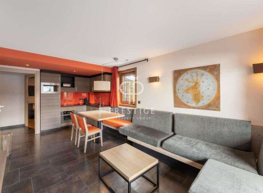 Discover a stylish living space with a modern kitchen and dining area, perfect for entertaining.