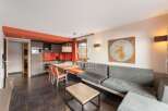 Discover a stylish living space with a modern kitchen and dining area, perfect for entertaining.