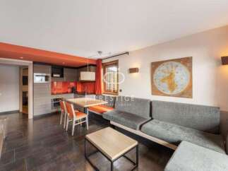 Discover a stylish living space with a modern kitchen and dining area, perfect for entertaining.