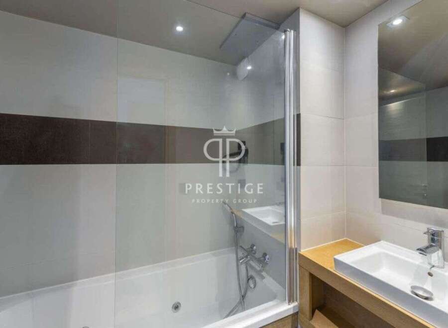 Discover luxury living in this stunning property! Featuring a modern bathroom with a sleek design, this space offers both style and functionality.