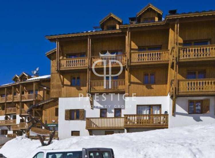 Discover the charm of this stunning property, boasting exquisite wooden balconies and a warm, inviting facade.