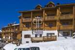 Discover the charm of this stunning property, boasting exquisite wooden balconies and a warm, inviting facade.