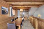 This stunning property boasts a warm and inviting interior with beautiful wooden accents throughout.
