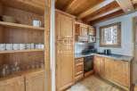 Discover the charm of this cozy kitchen, featuring warm wooden cabinetry and a rustic aesthetic.