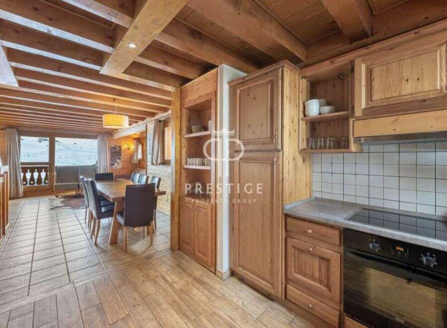 Discover the charm of this stunning property, featuring a warm and inviting interior with wooden accents throughout.