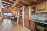 Discover the charm of this stunning property, featuring a warm and inviting interior with wooden accents throughout.
