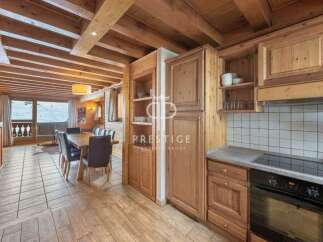 Discover the charm of this stunning property, featuring a warm and inviting interior with wooden accents throughout.