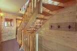 Discover the charm of this property, featuring a beautifully crafted wooden staircase that adds warmth and character.