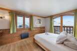 Discover a cozy bedroom with stunning mountain views.