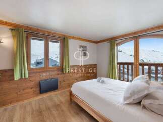 Discover a cozy bedroom with stunning mountain views.