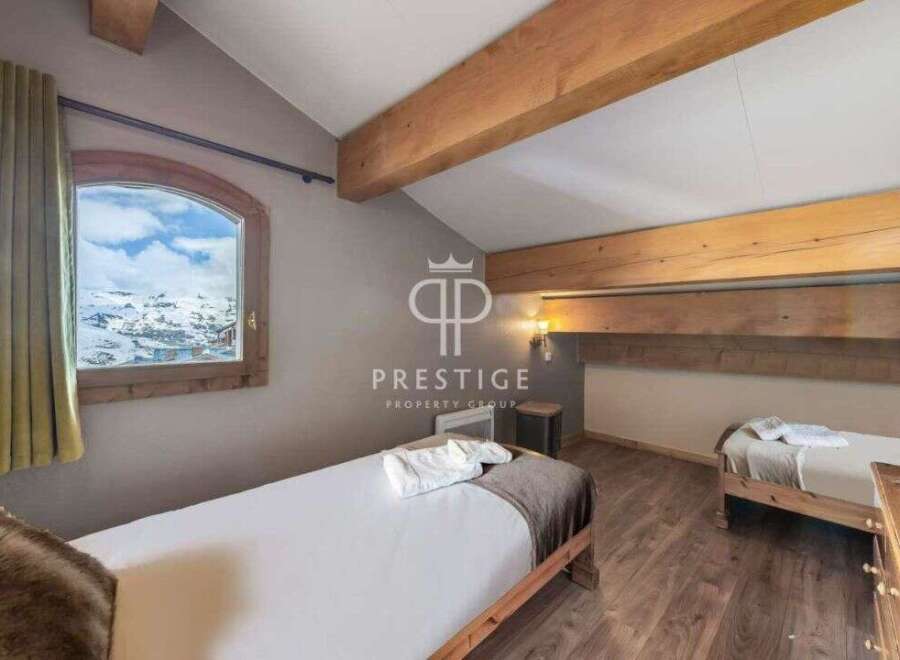 Discover a cozy bedroom with stunning mountain views.