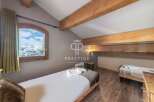 Discover a cozy bedroom with stunning mountain views.