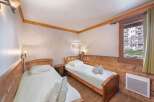 Cozy bedroom with two single beds, perfect for a comfortable stay.