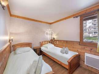 Cozy bedroom with two single beds, perfect for a comfortable stay.
