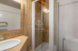 Discover a modern bathroom with a sleek shower enclosure.