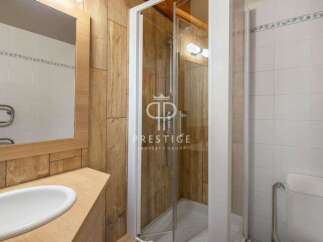 Discover a modern bathroom with a sleek shower enclosure.