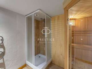Discover luxury living with this stunning property featuring a modern shower and a relaxing sauna.