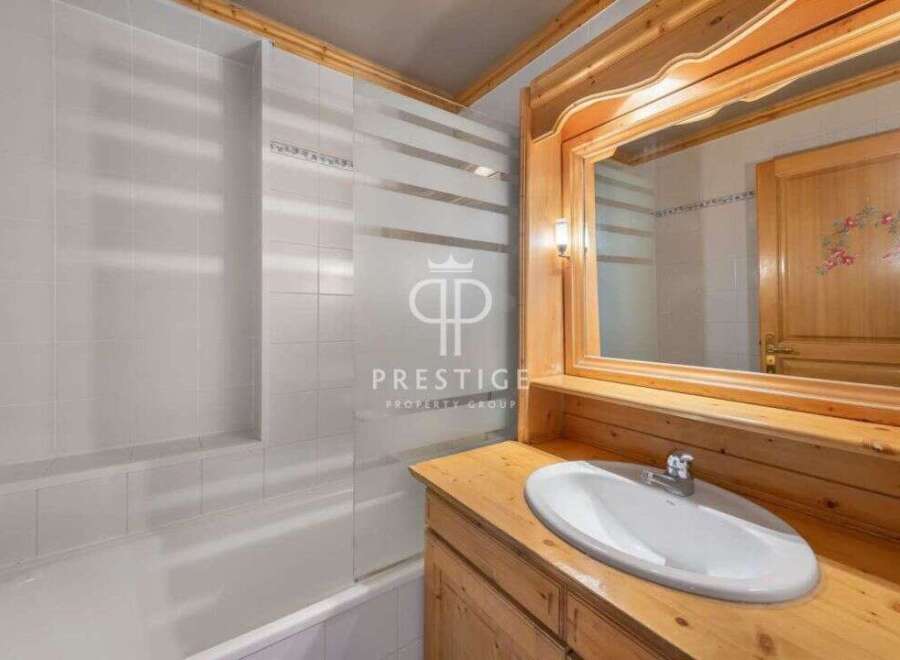 Discover the charm of this bathroom featuring a stylish vanity and a sleek sink.