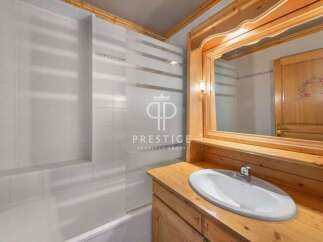 Discover the charm of this bathroom featuring a stylish vanity and a sleek sink.