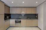 Discover a modern kitchen with sleek cabinetry and a stylish backsplash.