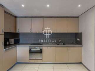 Discover a modern kitchen with sleek cabinetry and a stylish backsplash.