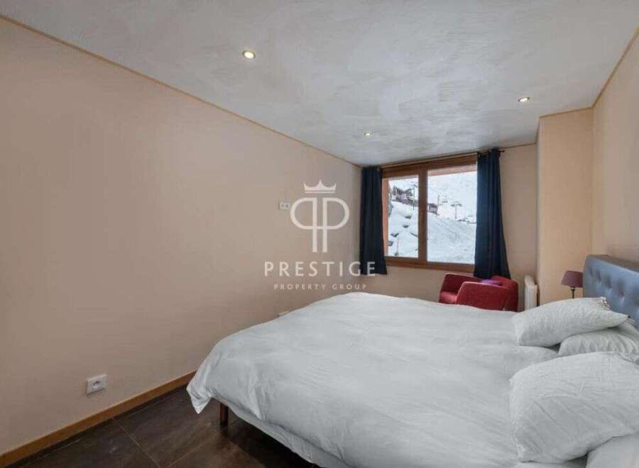 Discover a cozy bedroom with a stunning mountain view.