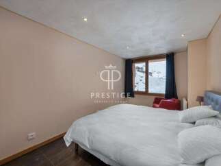 Discover a cozy bedroom with a stunning mountain view.
