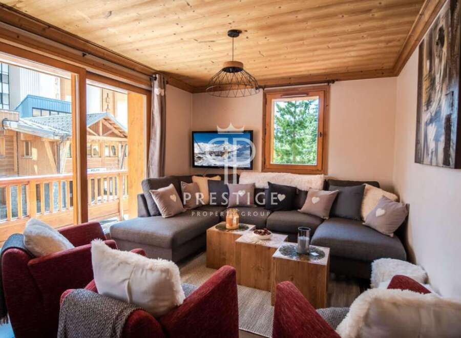 Discover the charm of this cozy living space, featuring a comfortable sectional sofa perfect for relaxation.
