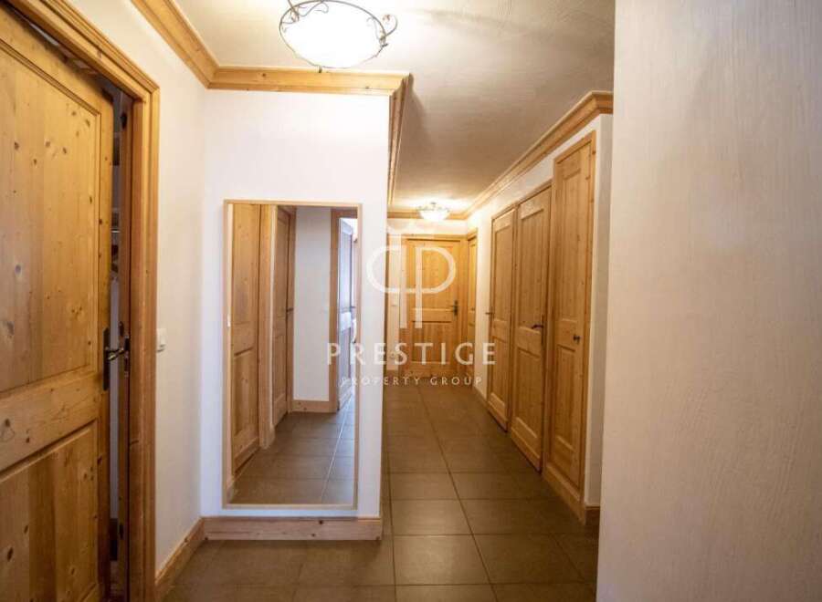 Discover the charm of this property, featuring elegant wooden doors and trim that exude warmth and sophistication.