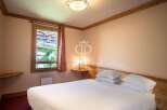 Discover a cozy bedroom with a stunning view.