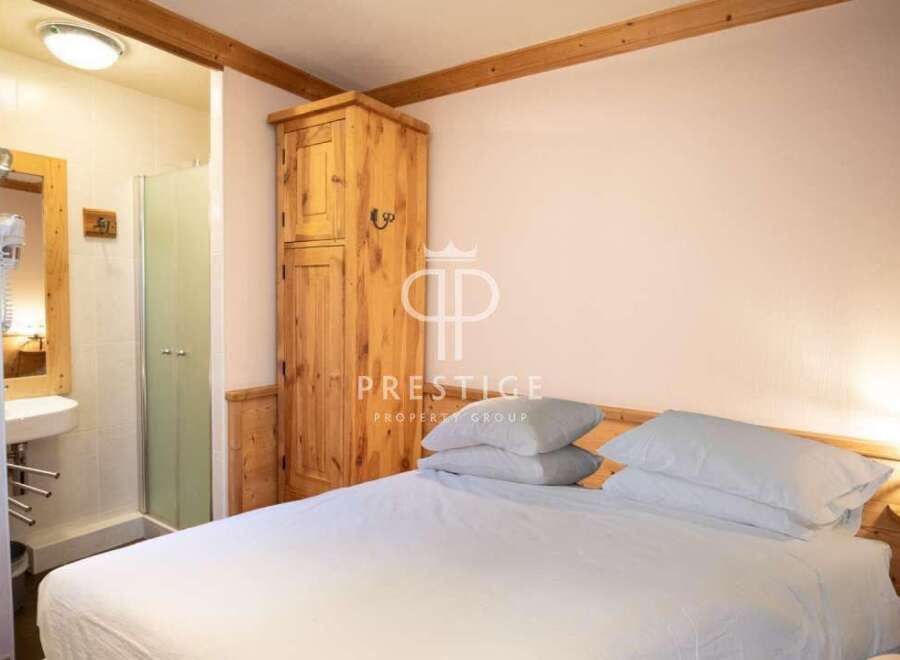 Discover a cozy bedroom with a touch of rustic charm.