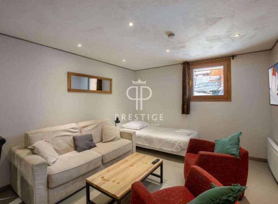 Cozy living space with a comfortable sofa and inviting armchairs.