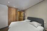 Discover a serene bedroom featuring a comfortable bed and a stylish headboard.