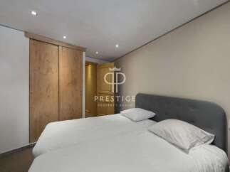 Discover a serene bedroom featuring a comfortable bed and a stylish headboard.