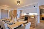 Discover a stunning property featuring a modern kitchen with sleek cabinetry and integrated appliances.