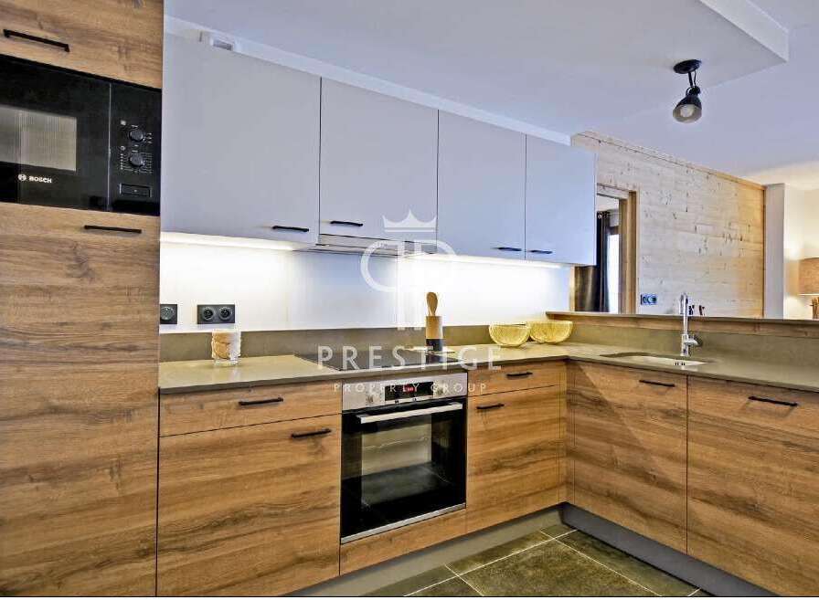 Modern kitchen design featuring sleek cabinetry and integrated appliances.