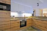 Modern kitchen design featuring sleek cabinetry and integrated appliances.