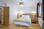 Discover the epitome of comfort in this stunning bedroom.