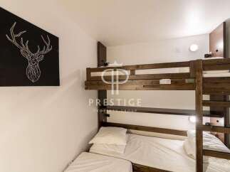 Cozy bunk beds offer a comfortable sleeping arrangement, perfect for families or groups.