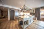 This stunning kitchen boasts a spacious island, perfect for culinary creations and entertaining.