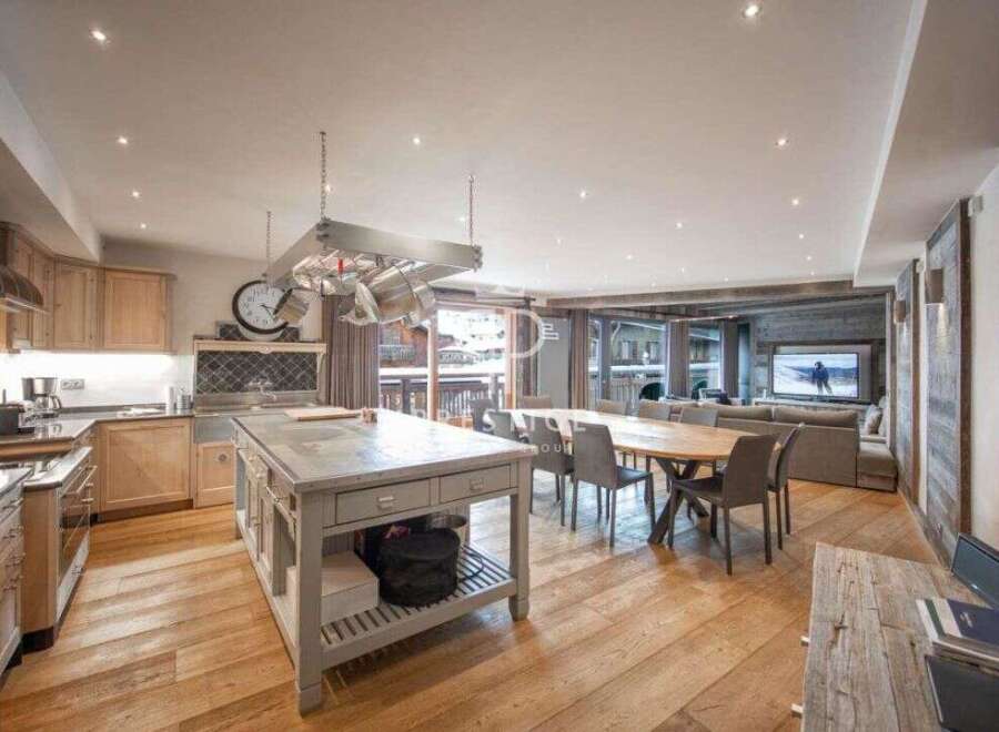 Experience luxury living in this stunning property, featuring a spacious open-plan kitchen and dining area.