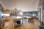 Experience luxury living in this stunning property, featuring a spacious open-plan kitchen and dining area.