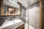 Discover luxury living in this stunning property! Featuring a modern bathroom with a sleek shower and a stylish sink, this space is designed for comfort and elegance.