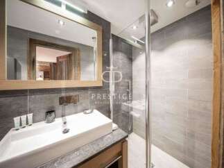 Discover luxury living in this stunning property! Featuring a modern bathroom with a sleek shower and a stylish sink, this space is designed for comfort and elegance.