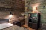 Experience rustic charm in this stunning bedroom featuring reclaimed wood walls.